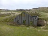 One of four surviving roofless structures thought to be the earliest known surviving group of mass-concrete magazines, dating to the 1890s